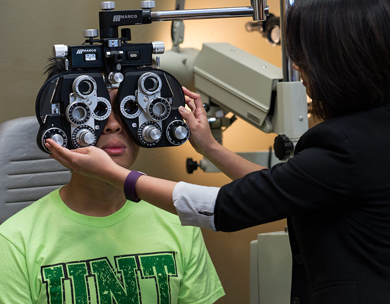 A student receiving an eye exam