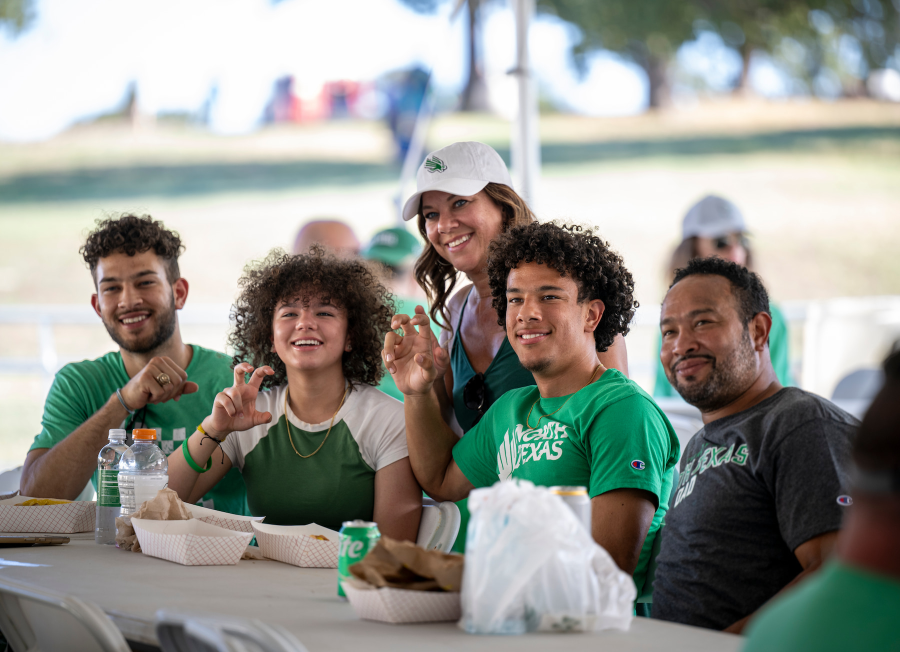 People posing outside at a game